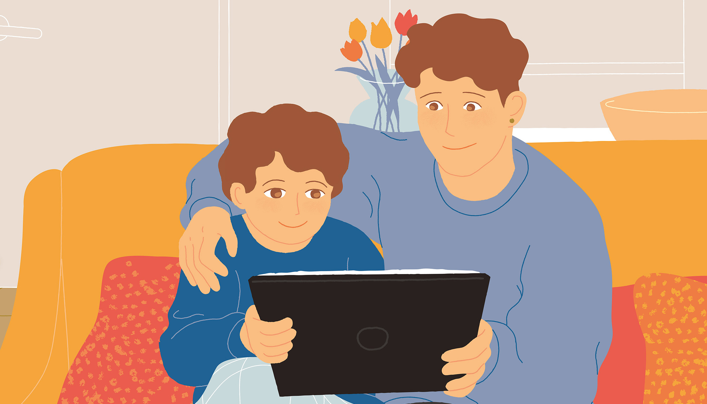 Et barn og en forælder kigger på en tablet.